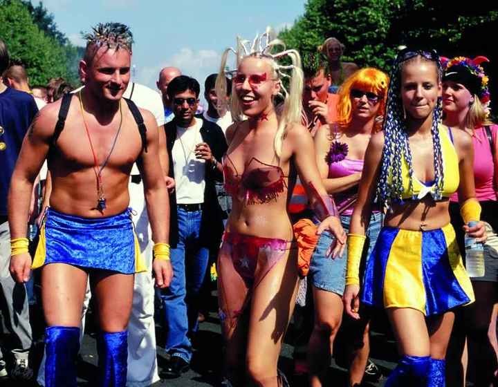 Love Parade Berlin 1995 — group of ravers in coordinated blue and yellow velvet costumes with elaborate hairstyles